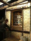 The kiln door is nearly unbricked - Jason Shackleton